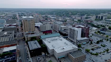 downtown davenport, iowa with drone video moving right to left at dusk wide shot