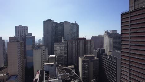 flying between buildings in consolacao, sunny sao paulo, brazil - aerial view