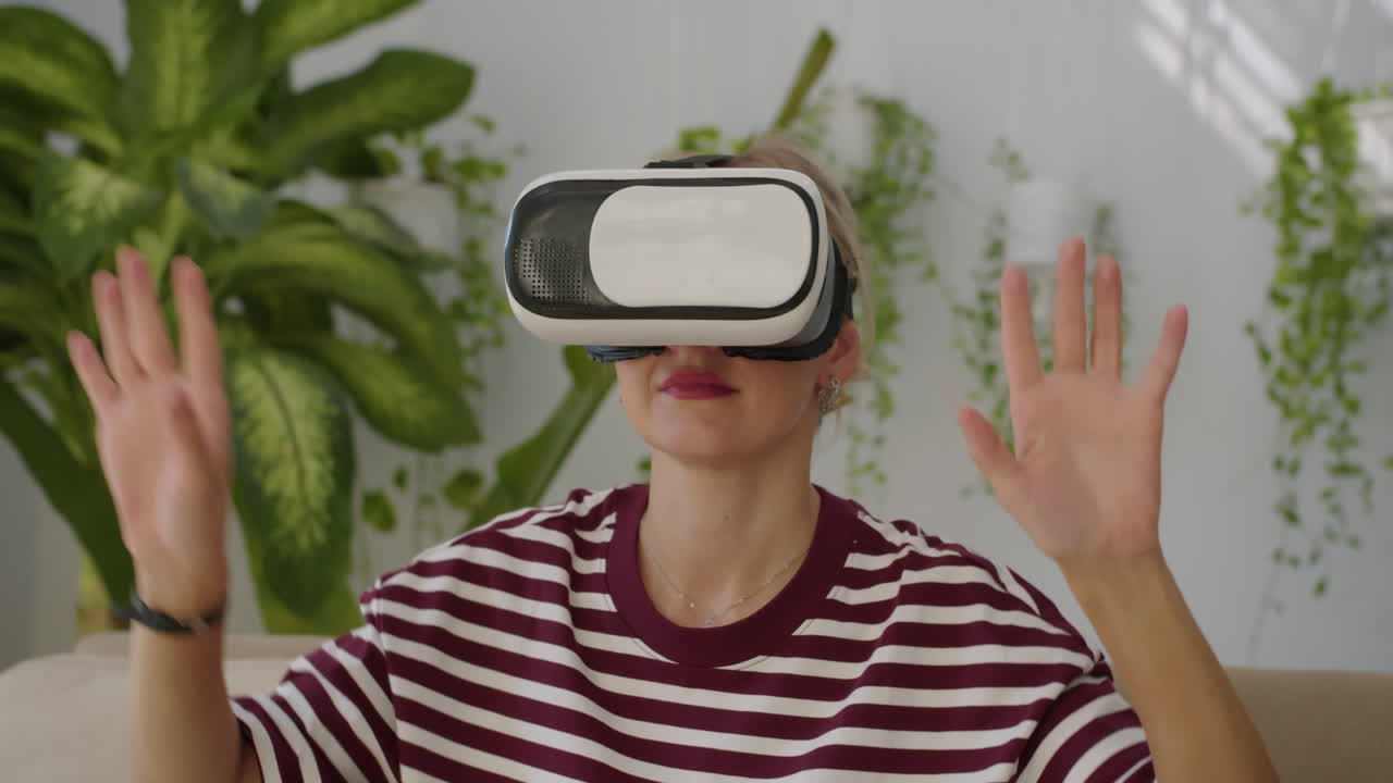 Woman in VR Headset Playing Video Game Indoors