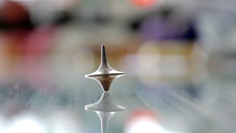 Whirligig-spinning-on-a-glass-table-in-slow-motion