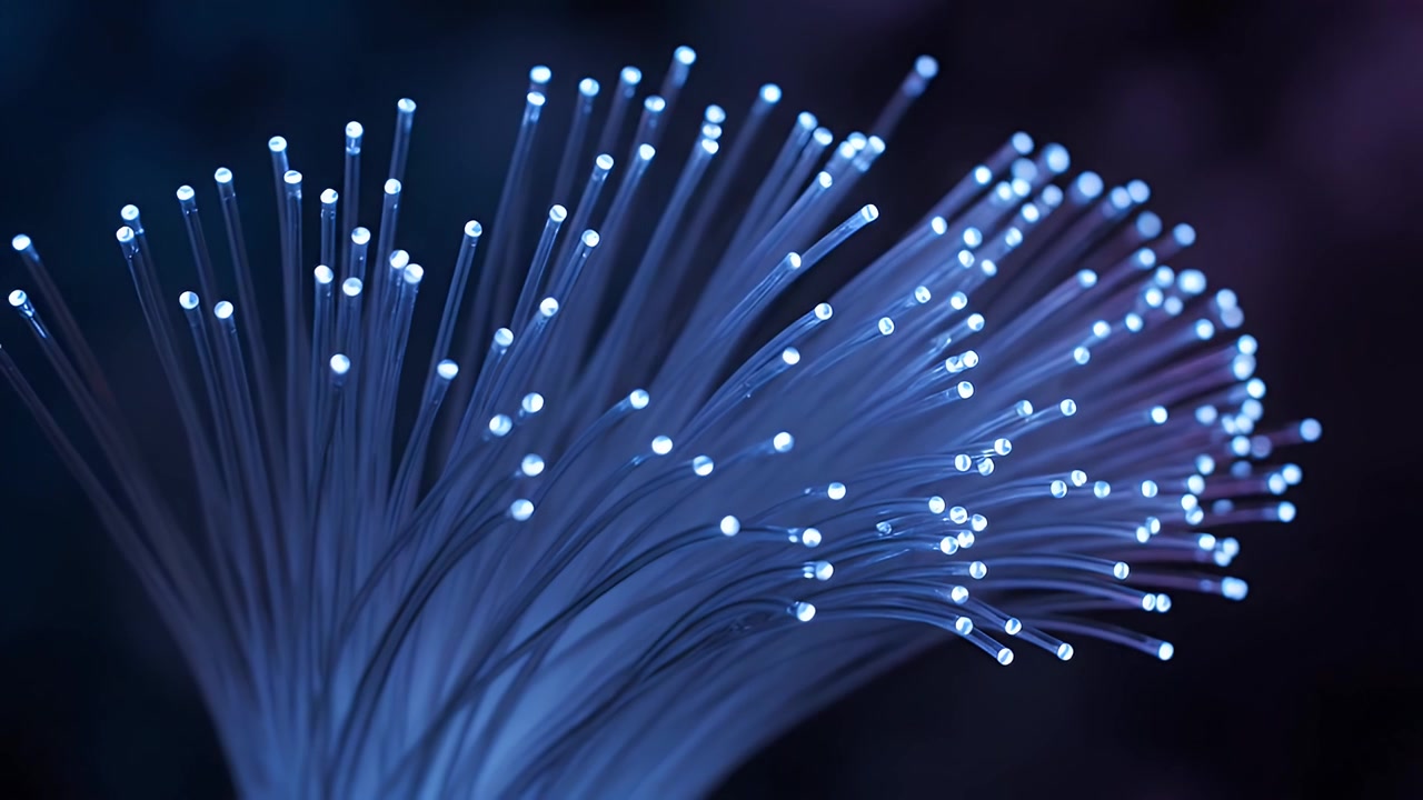 Glowing Fiber Optic Cables Transmitting Data