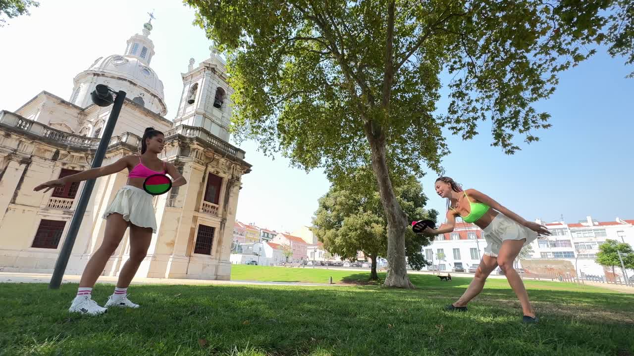 Two women exercising in a park