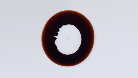 dark oil ring on a white surface