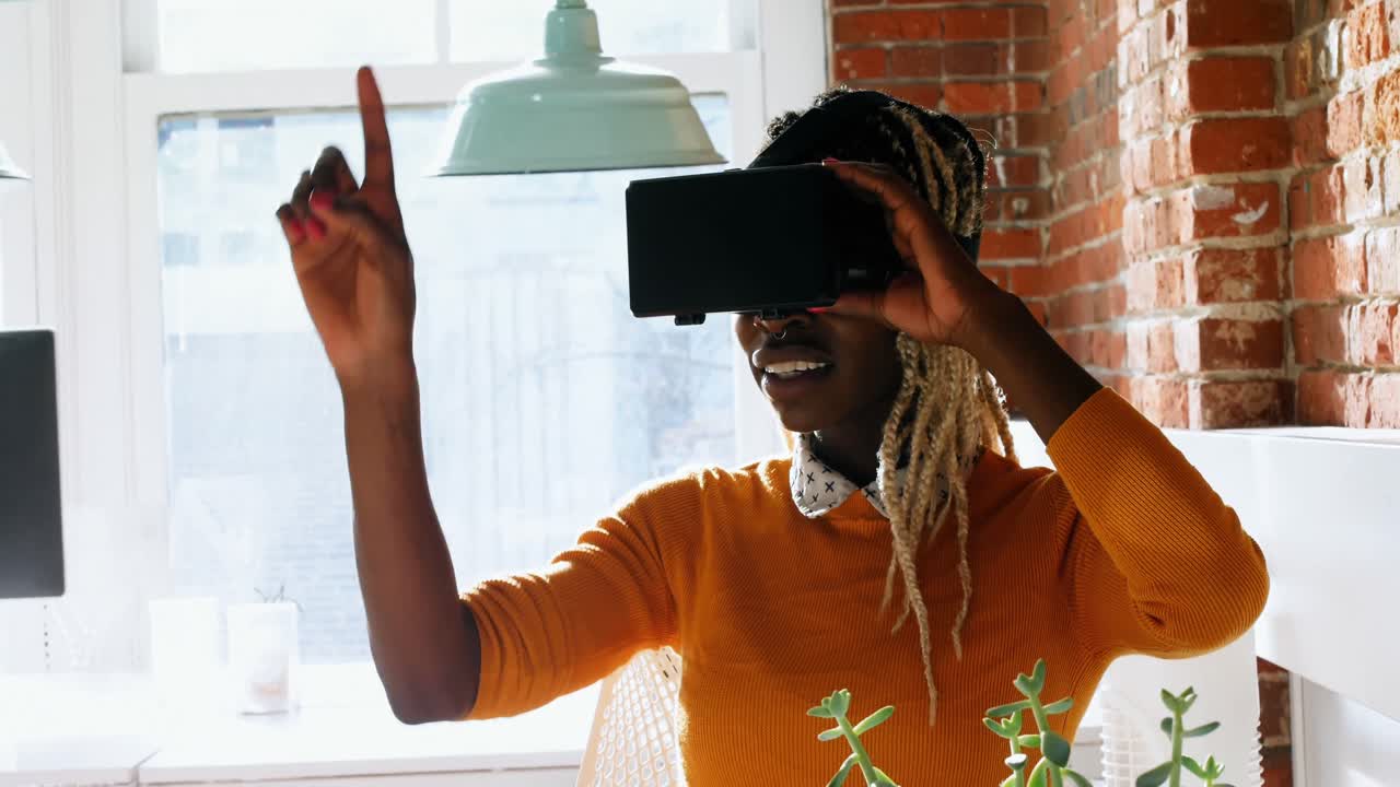 Female executive using virtual reality headset