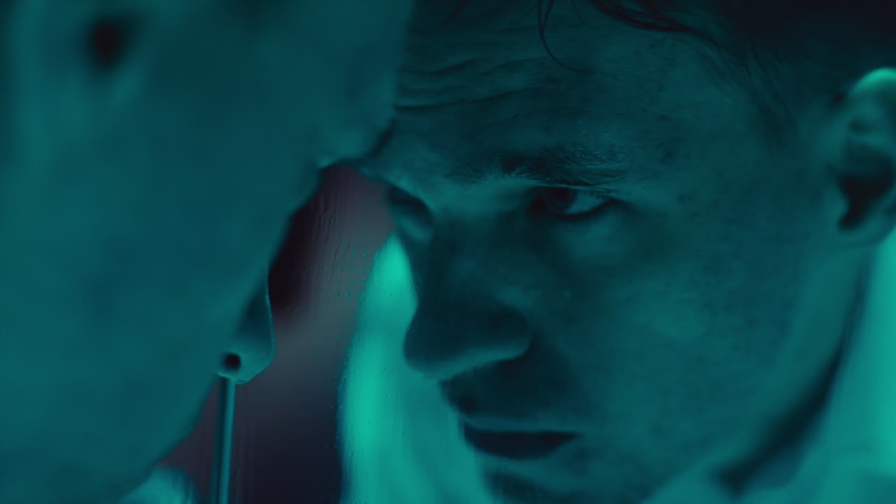 Close-up of faces in a dimly lit environment