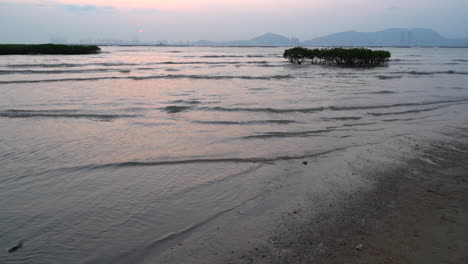 Slow-motion-sunset-at-Pak-Nai-wetlands-in-Hong-Kong-overseeing-Shenzhen-China-covered-by-haze