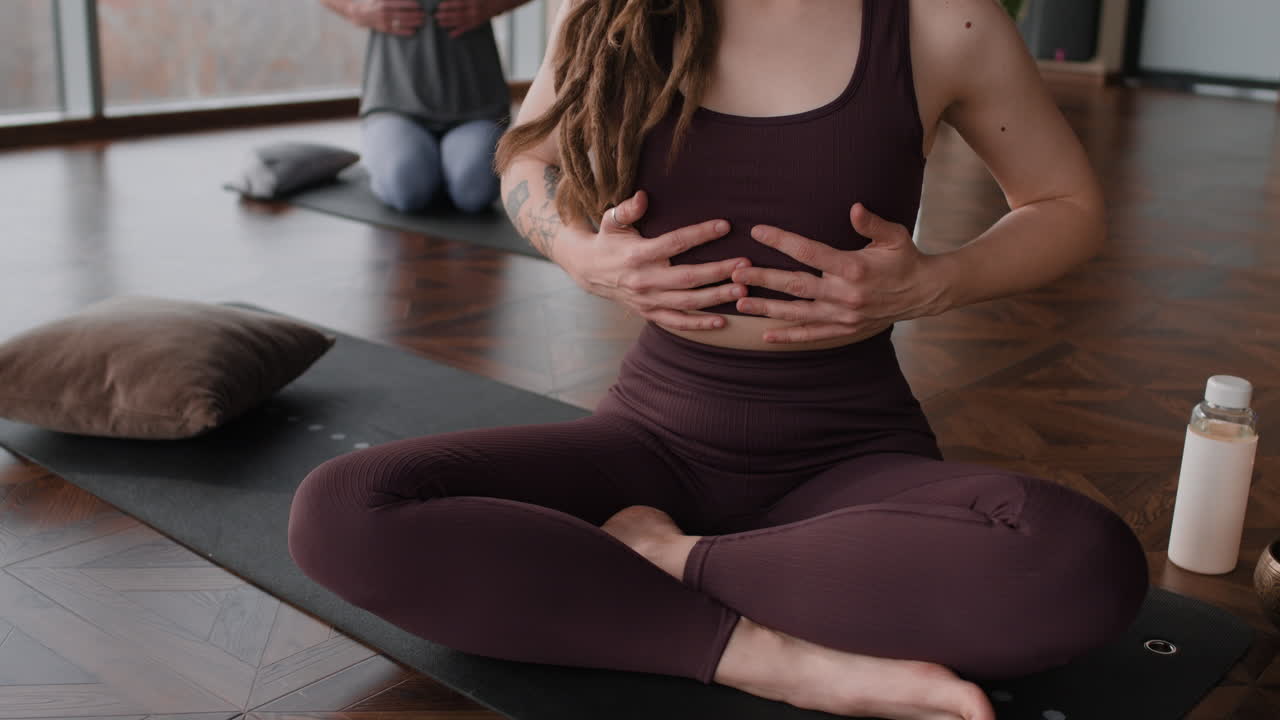 Woman practicing seated yoga pose