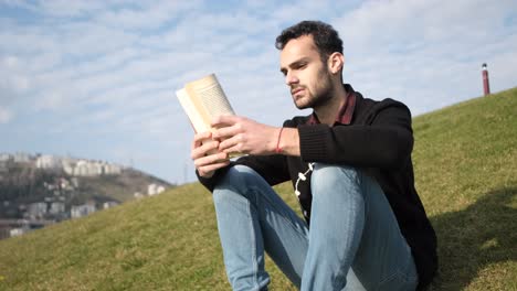 Man-Perusing-Book-Outside