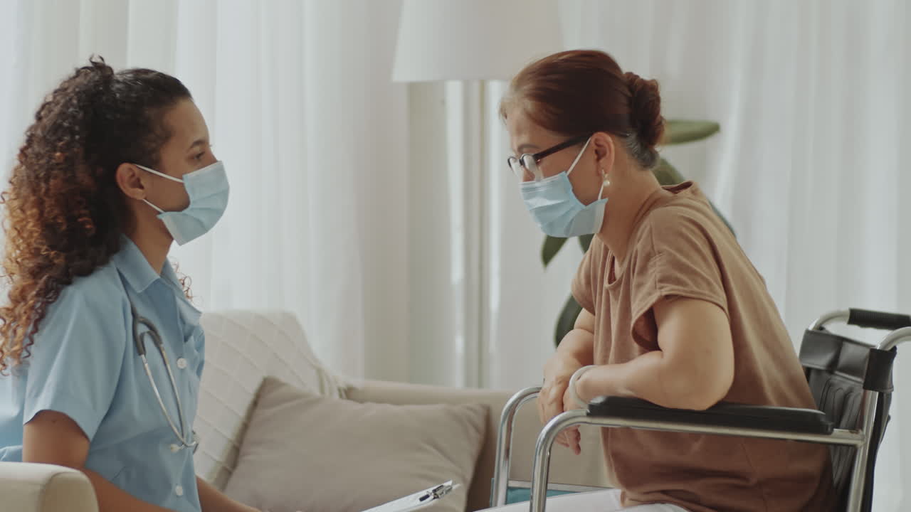 Nurse visits elderly woman at home