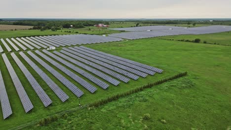 Aerial-View-Of-Industrial-Solar-Power-Energy-Farm---drone-shot