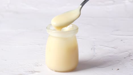 Condensed-milk-in-a-bowl-close-up