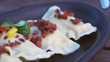 Traditional-polish-Pierogi---dumplings-stuffed-with-cottage-cheese,-boiled-potatoes,-fried-onion-and-black-pepper