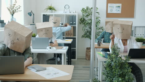 funny office workers with paper bags on their heads