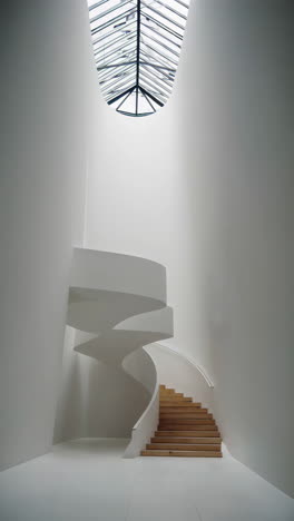 modern spiral staircase in a white interior