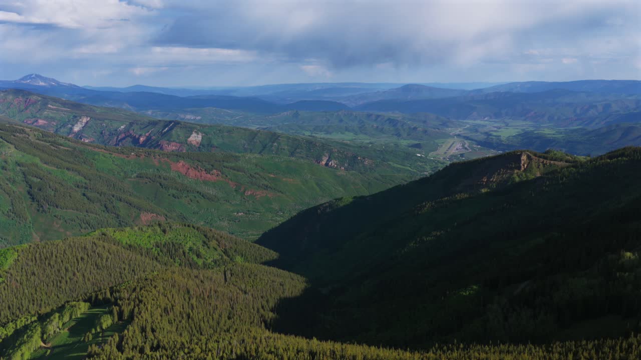 Aspen Pitkin County Airport spring summer Aspen Highlands Little Annie Basin Trailhead AJAX top of Aspen Mountain aerial drone melting snow Rocky Mountains morning sunny blue sky forward