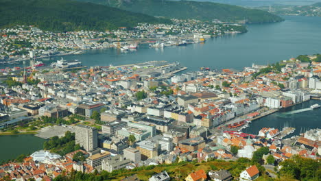 a view of the city of bergen below are the marinas and large cruise ships 4k video