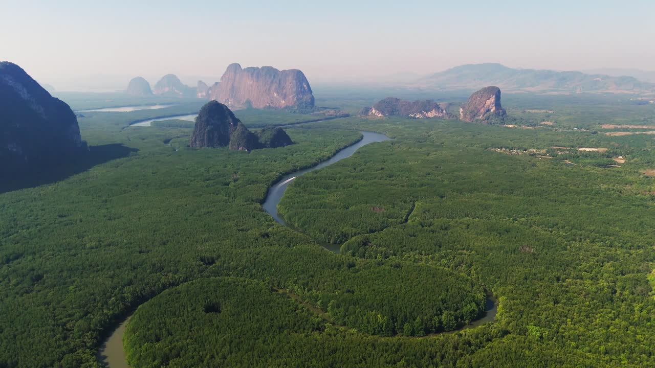 Aerial Scenic bay with limestone cliffs, mangrove forests, and island in Phang Nga National Park, Southern Thailand