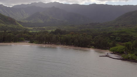 Push-over-ocean-and-shore-and-onto-land-in-Oahu,-Hawaii