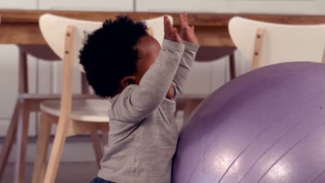 cute baby playing with exercise ball