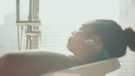 woman relaxing in a bathroom spa treatment