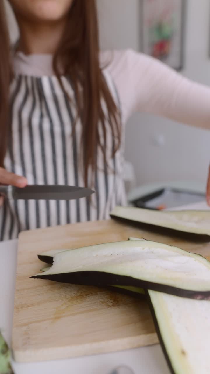 Woman Cutting Eggplant