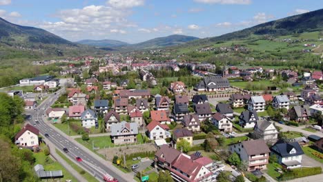 mszana dolna village in southern poland on sunny summer day, aerial panorama