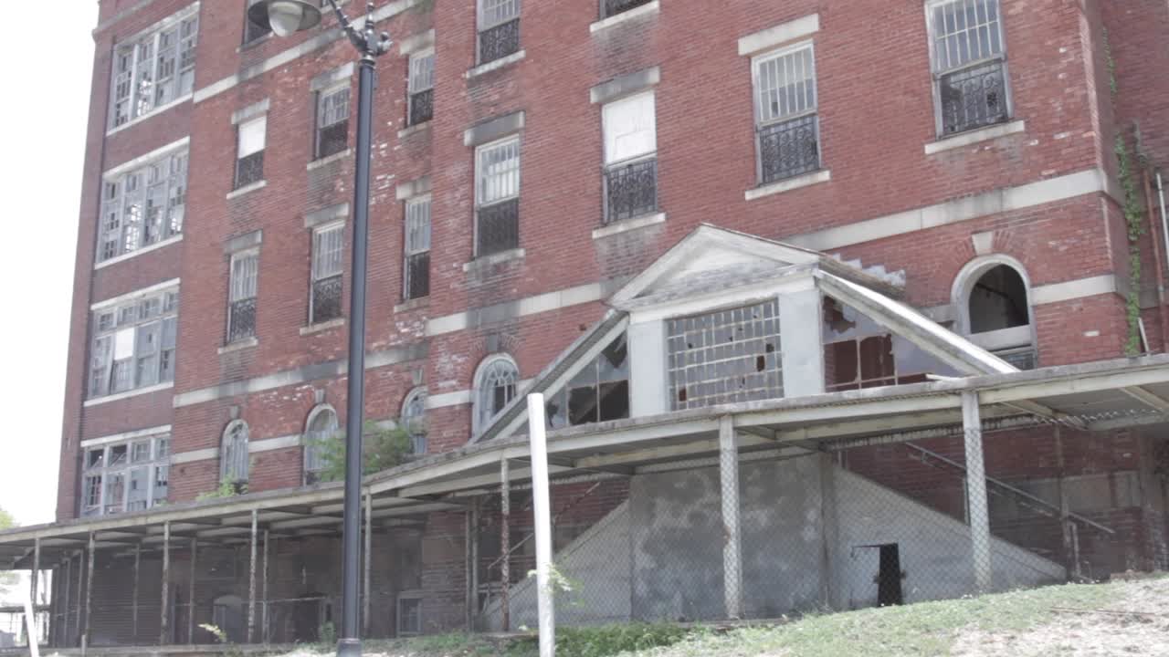 Front view of dilapidated mental institution