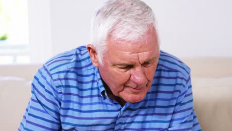 Mature-man-reading-his-newspaper-and-drinking-his-newspaper