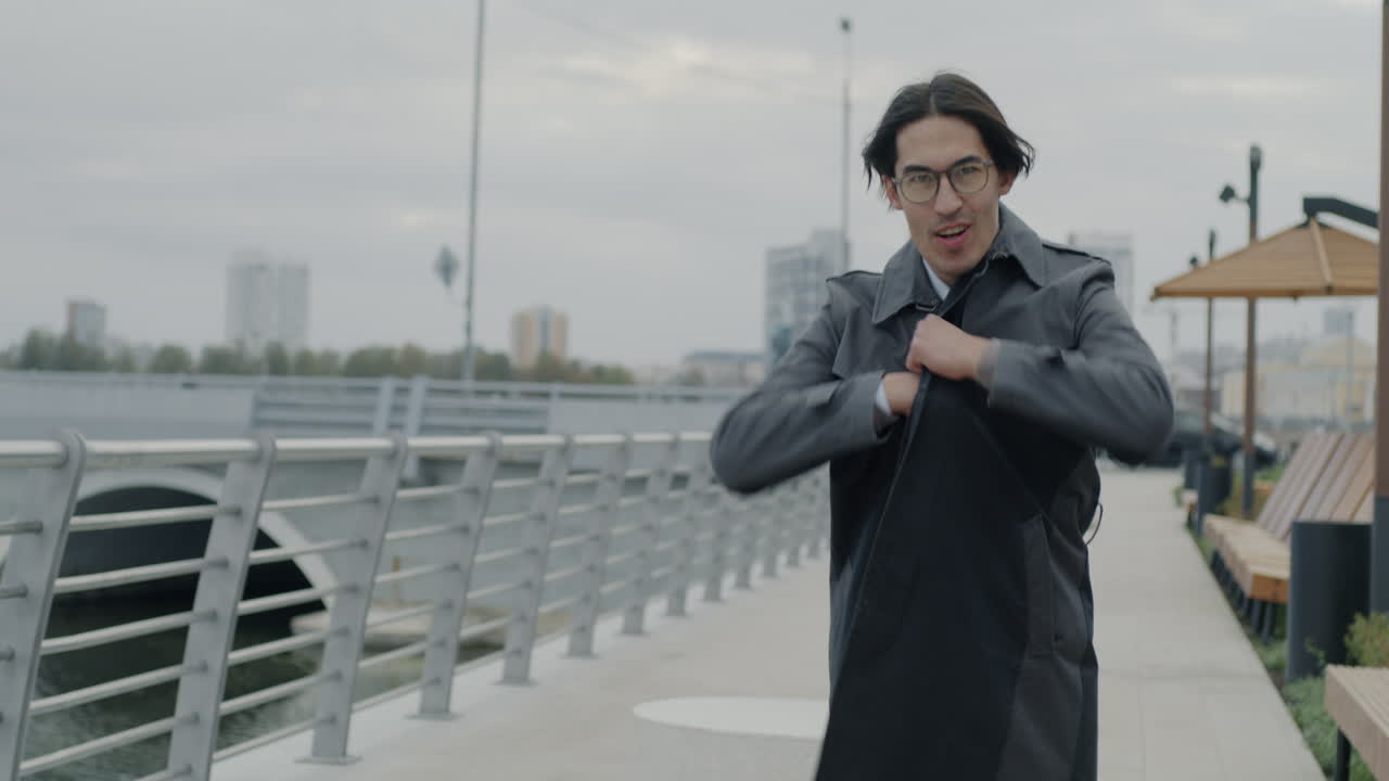 Smiling Man Walking in City Park