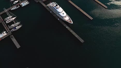 aerial footage of a luxurious yacht in the harbour