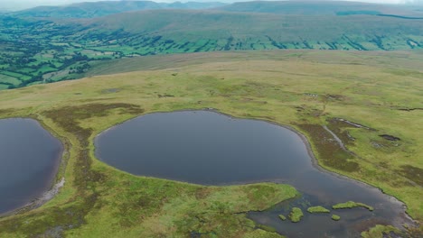 Aerial-pan-shot-of-Whernside-tarns-in-Yorkshire-Dales-in-Northern-England