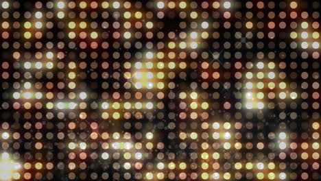 sparkling colorful light dots creating animation over dark background