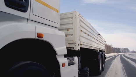 white kamaz truck on a snowy road