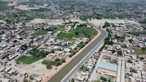 homes and road on the bank of the stream