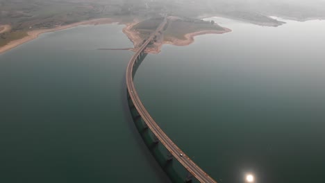 aerial reveal shot of long lake bridge with