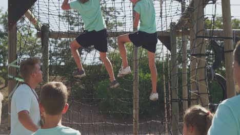 group of caucasian children training at boot camp