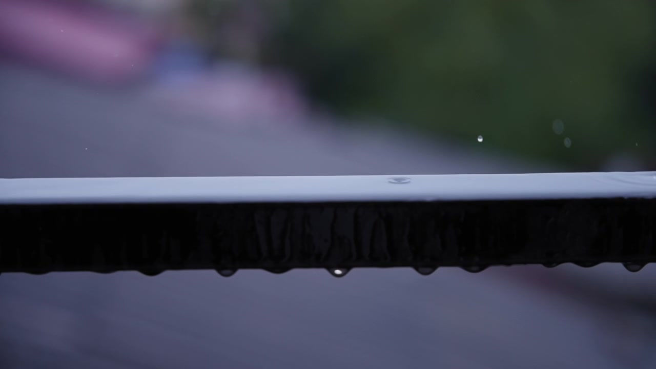 Rain drops on stainless steel fence