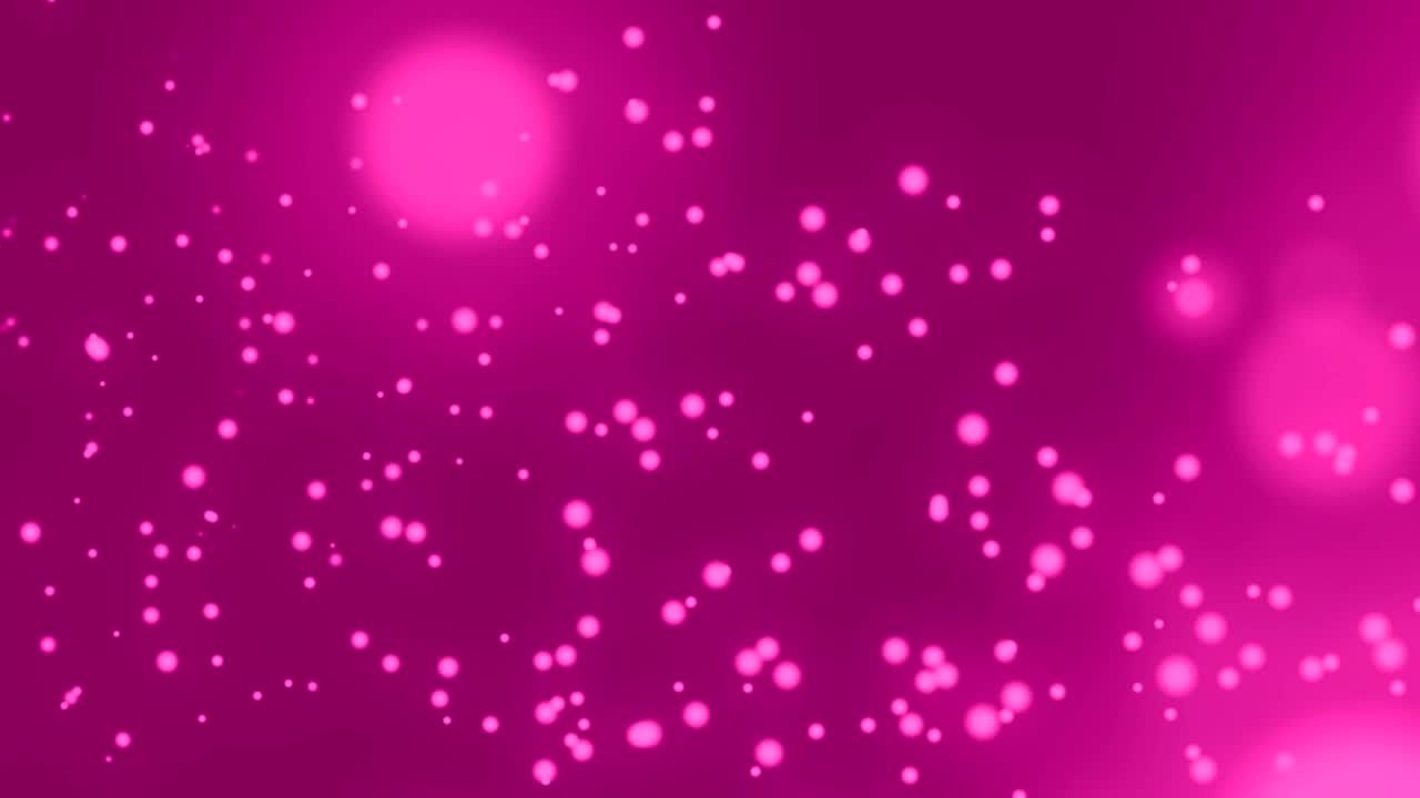 manchas brillantes que se mueven contra un fondo rosado