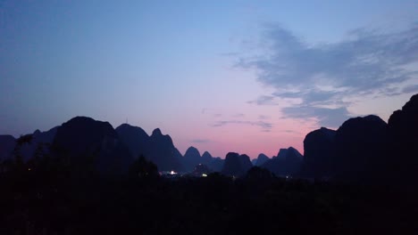beautiful impressive karst mountain landscape in yangshuo at dusk, guangxi province, china