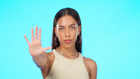 hand, stop and face of woman in studio