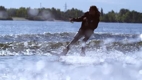 wakeboarder training on river. extreme sport wakeboarding