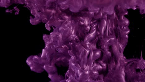 ink in water. colour pink glitter paint reacting in water creating abstract cloud formations.can be used as transitions,added to modern grunge projects,art backgrounds, anything with creative twist