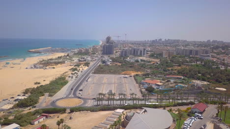 aerial in israel, ashkelon beach - flyby overlooking the city