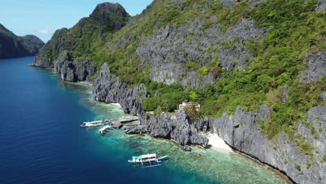 A-boat-tour-in-a-canyon-of-limestone-cliffs-with-crystal-clear-water