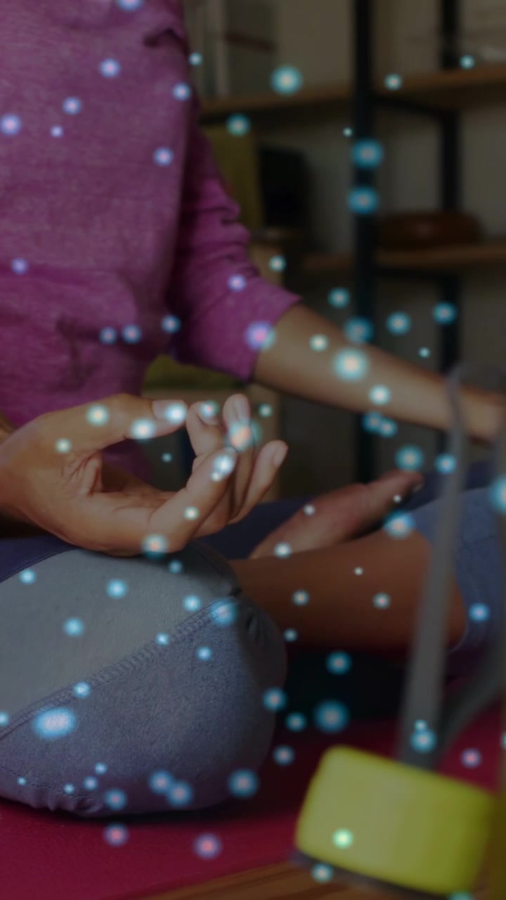 Vertical video: Woman on red mat blue overlay appearing holding mudra with small moves for health