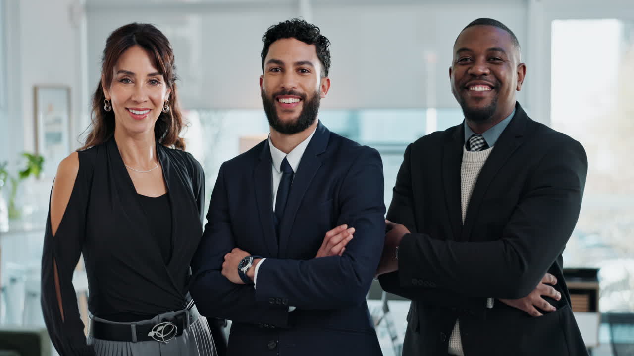 Three business professionals smiling in office