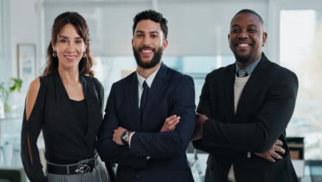 three business professionals smiling in office