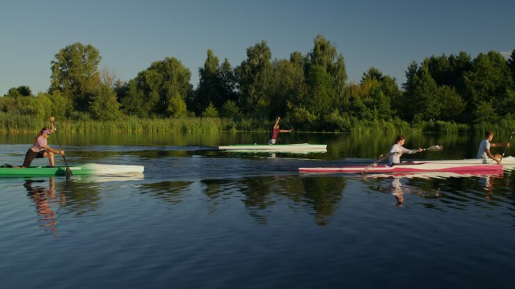 People Canoeing and Kayaking on a Lake