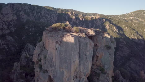 aerial orbit around the massive castle-like rock chateau fort in corsica