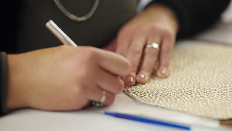 close-up of hands cutting material